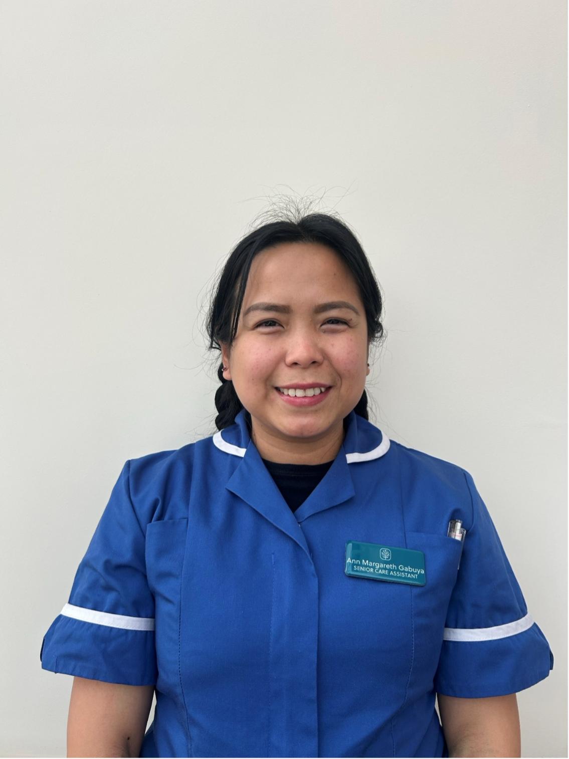 lady smiling at camera for staff photo